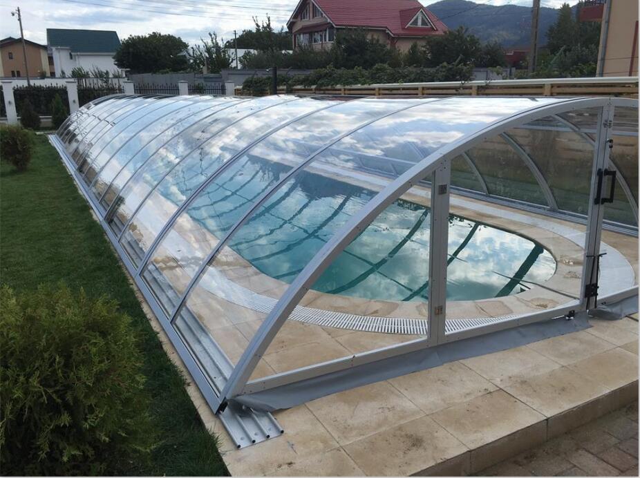 A fully installed pool and spa enclosure that covers the entire pool surface