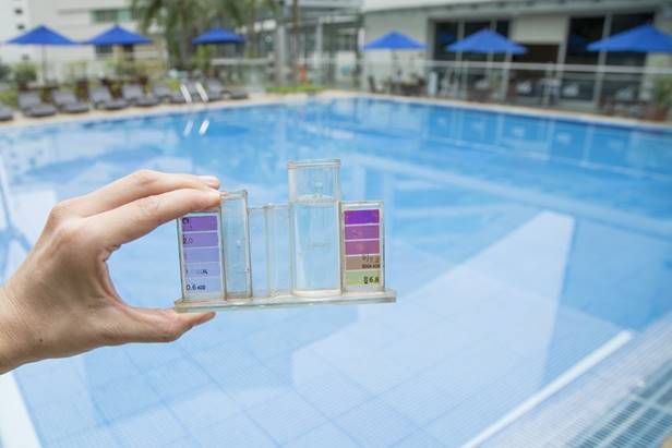 Treating swimming pool water