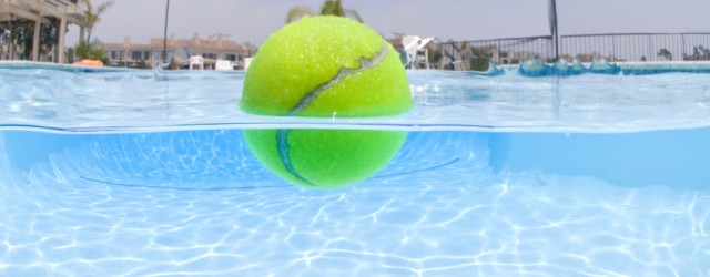 Remove oil layers from water using a tennis ball